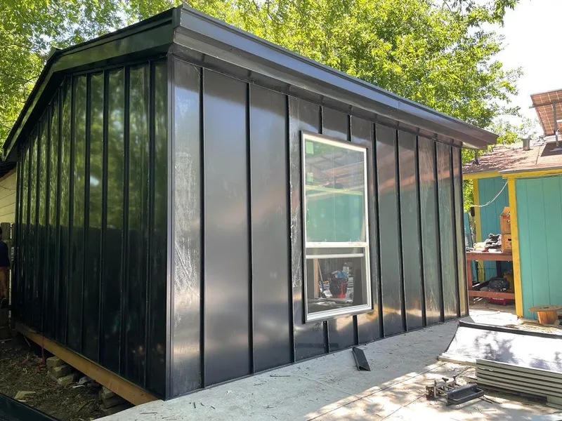 Black standing seam metal wall panels for Roof Inspection in New Bern