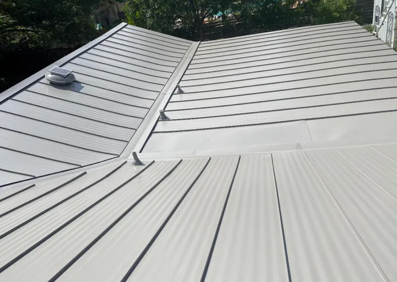 Solar attic fan installed on a metal roof for Roof Ventilation in New Bern